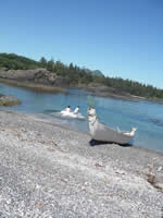 Couple by the Haida canoe